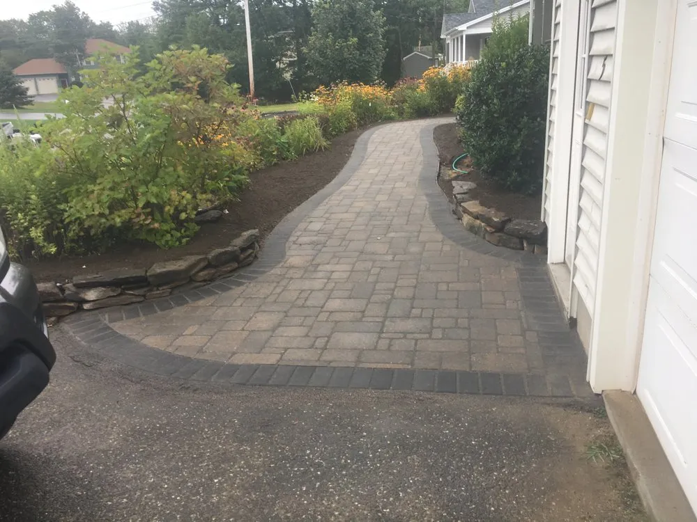 Custom lawn care service for year-round maintenance across Topsham, ME - Bursey Enterprises