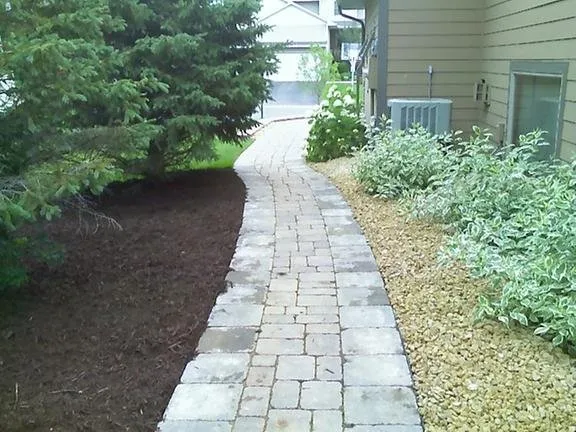 Custom lawn mowing service with custom design in Loretto, MN by Bury's Lawn & Landscape