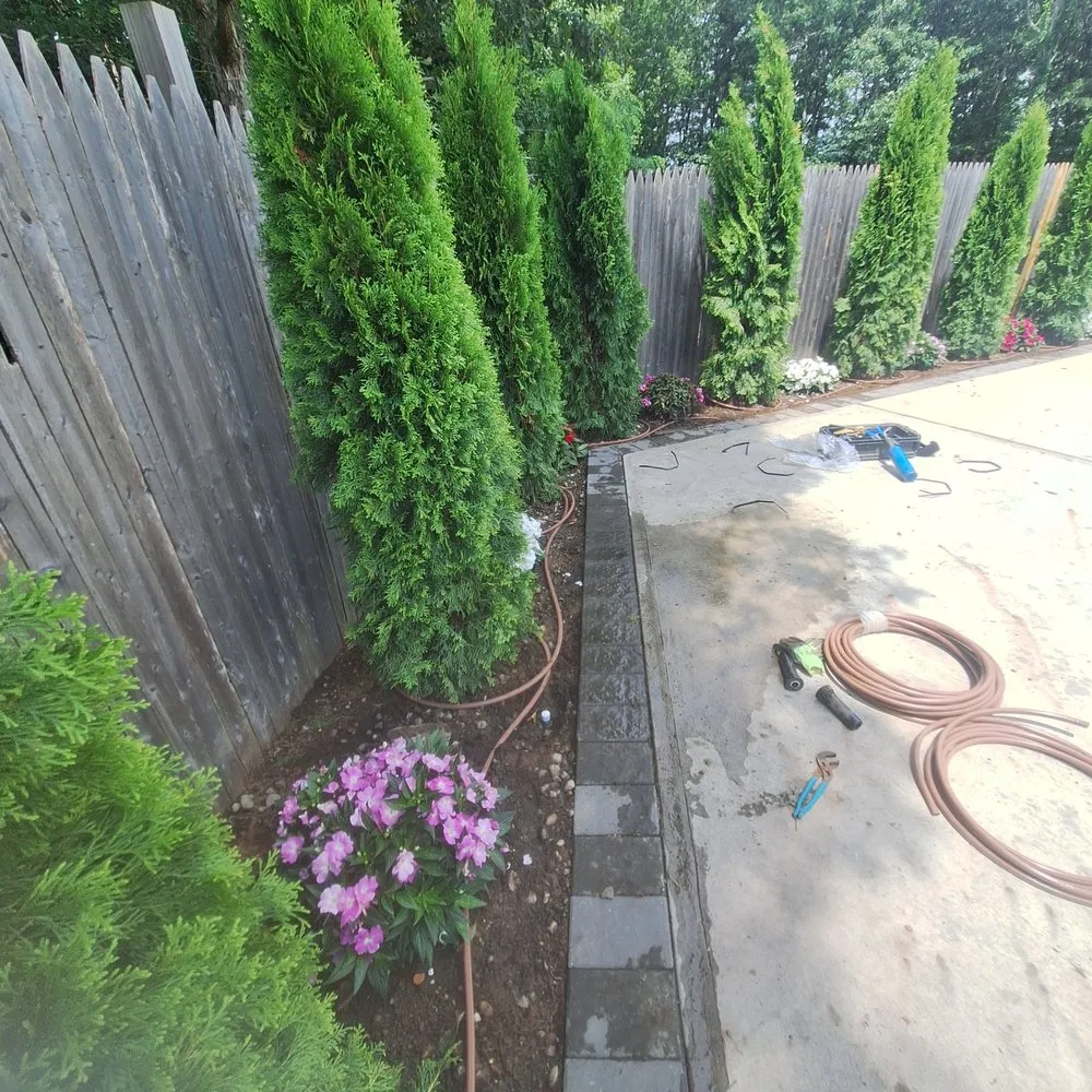 Expert landscape installation with custom design in Mastic, NY by Busy Bee Lawn Care
