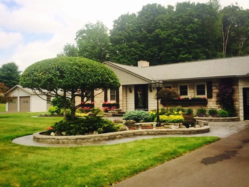 Professional lawn mowing service with custom design across Rome, NY - Busy B’s Landscape and Fence