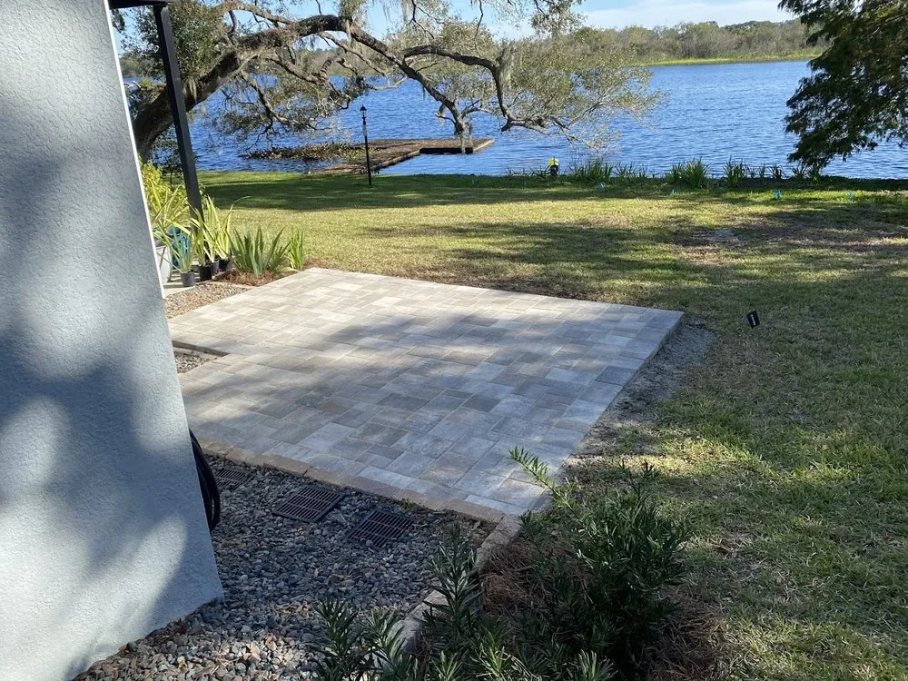 Professional landscape installation for residential properties in Tampa, FL by By Design Landscape