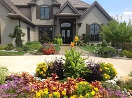Professional garden landscaping in Parkville, MO by By the Blade Lawn & Landscape