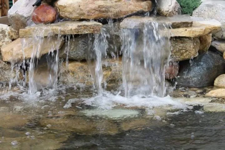 Custom landscape installation with custom design in Geneva, IL by Byrd Ponds