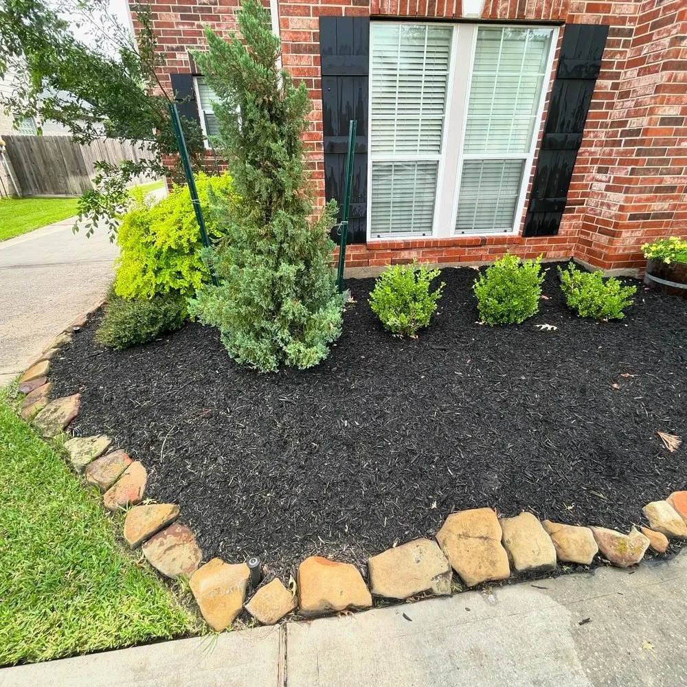 Custom outdoor landscaping with custom design in The Woodlands, TX by C & C Landscaping