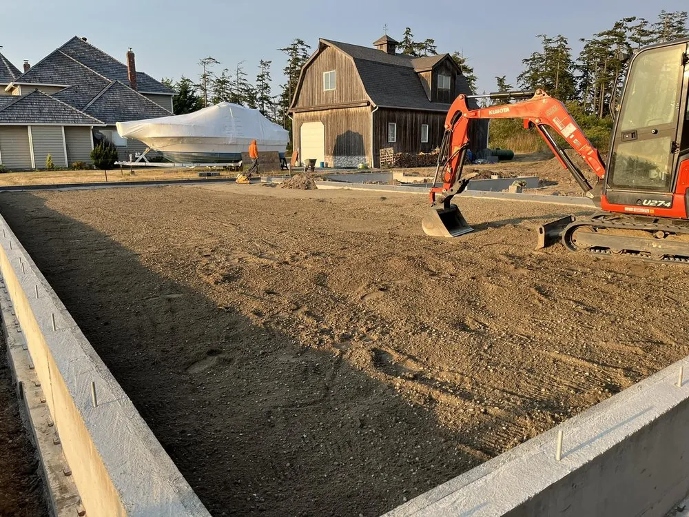 Expert yard cleanup service for year-round maintenance in Clinton, WA by C & C Wilkie Excavating and Landscaping