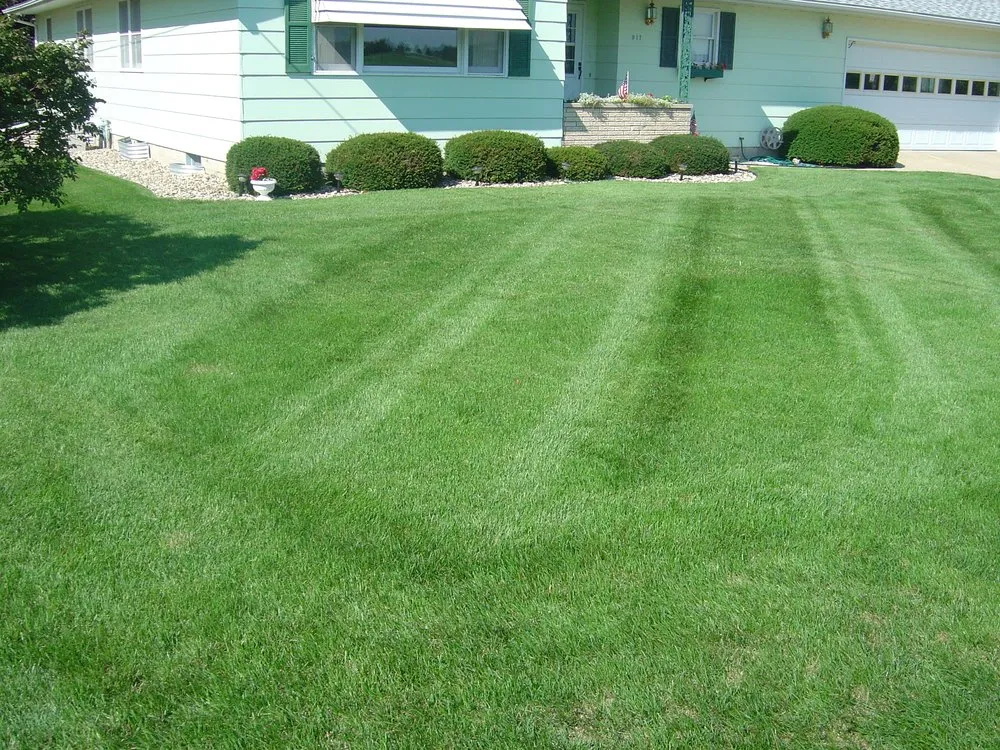 Professional lawn care service in New Hampton, IA by C & E Lane