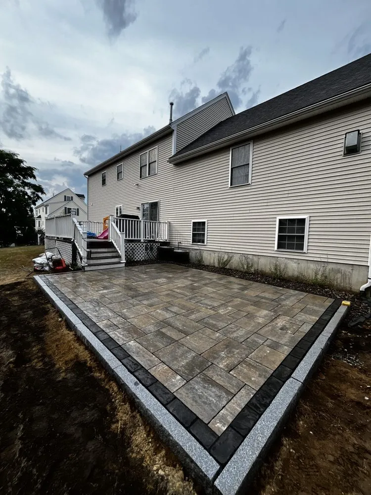 Affordable landscape installation with custom design in Plaistow, NH by Cabral Hardscapes
