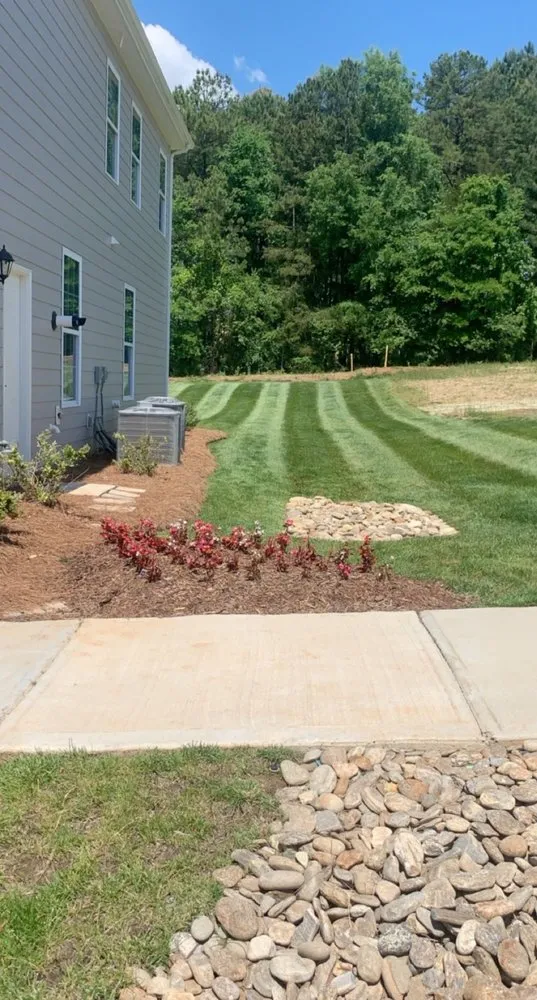 Custom landscape installation with custom design across Charlotte, NC - Cain’s Outdoor Services