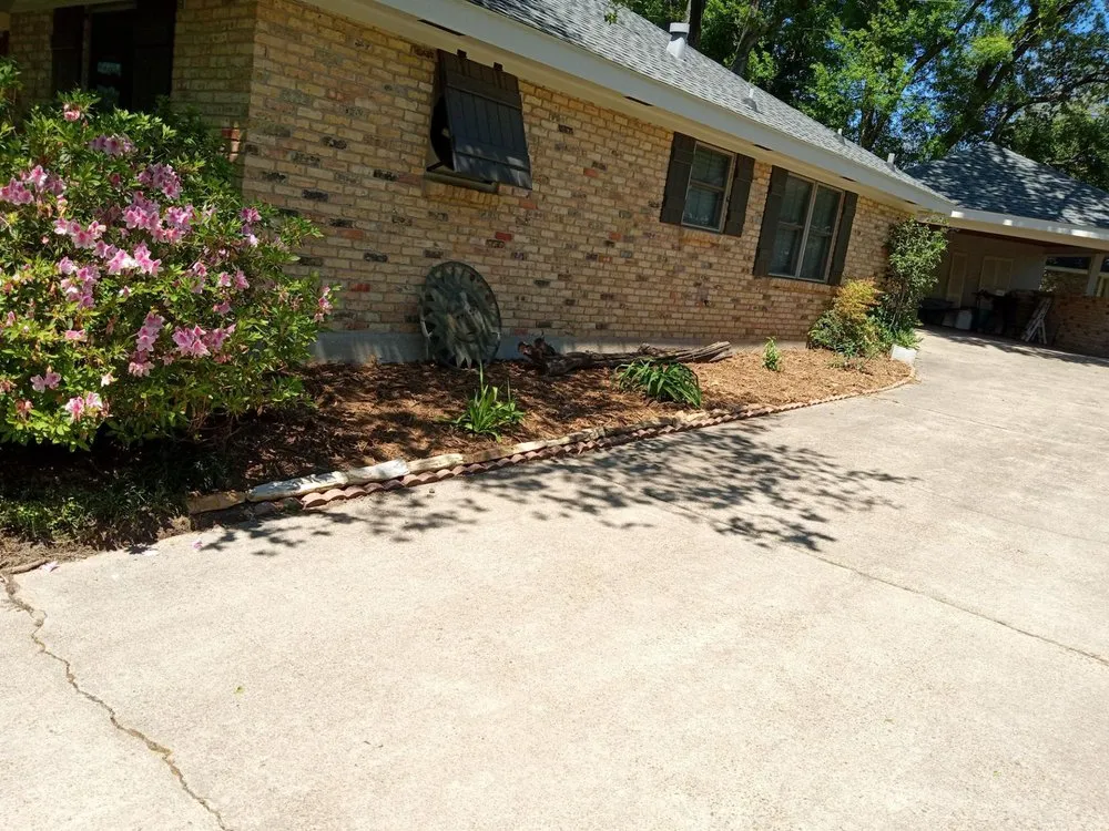 Custom outdoor landscaping with custom design in Jeanerette, LA by Cal's Lawn care