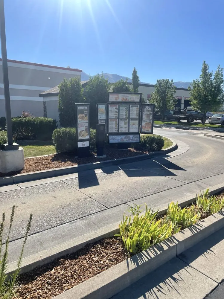 Custom landscape installation for year-round maintenance in Nibley, UT by Cannaday's Lawn care & Landscaping