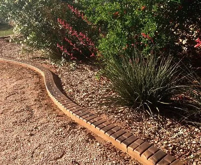 Affordable yard maintenance with custom design in Austin, TX by Capital Curbing