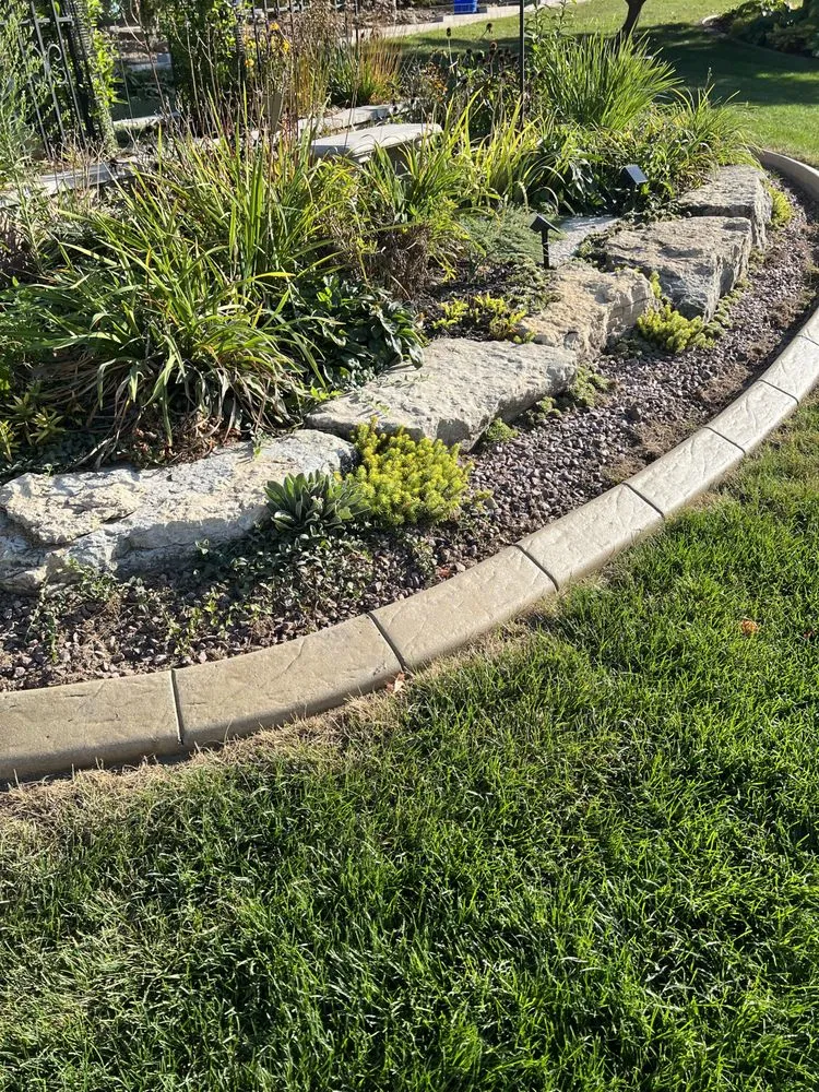 Custom landscape installation in Freeport, IL by Captain Curbing