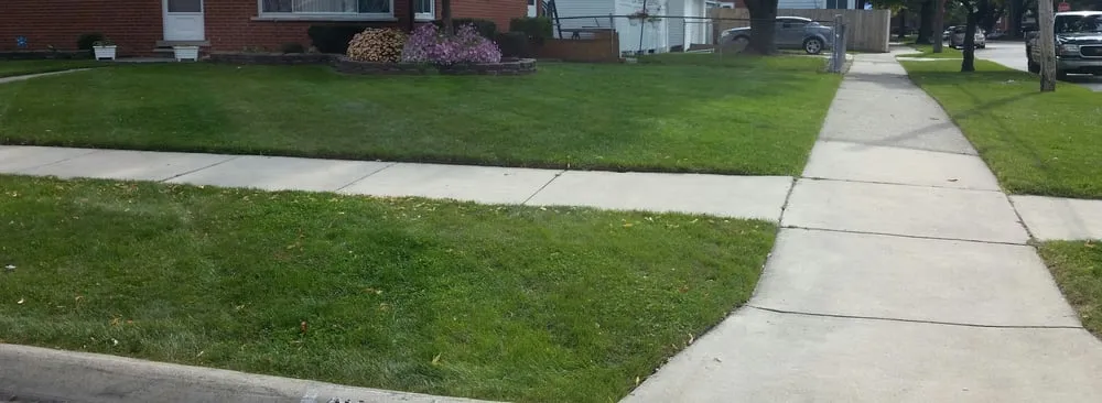 Custom lawn mowing service for year-round maintenance in Mount Clemens, MI by Careful Cuts Lawn Service LLC