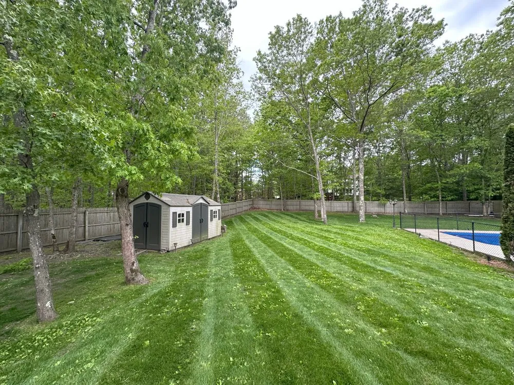 Custom lawn care service for year-round maintenance in Ridge, NY by Carman Landscaping