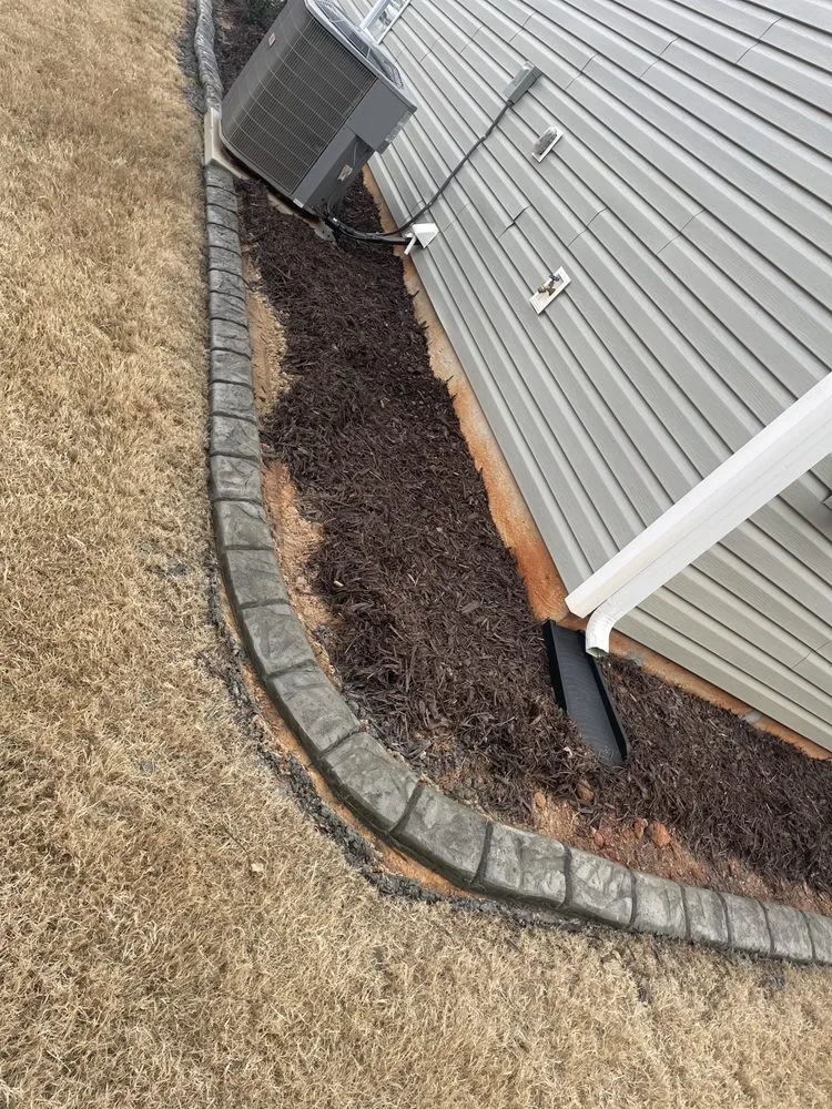 Affordable lawn mowing service for year-round maintenance in Columbia, SC by Carolina Curb Pros