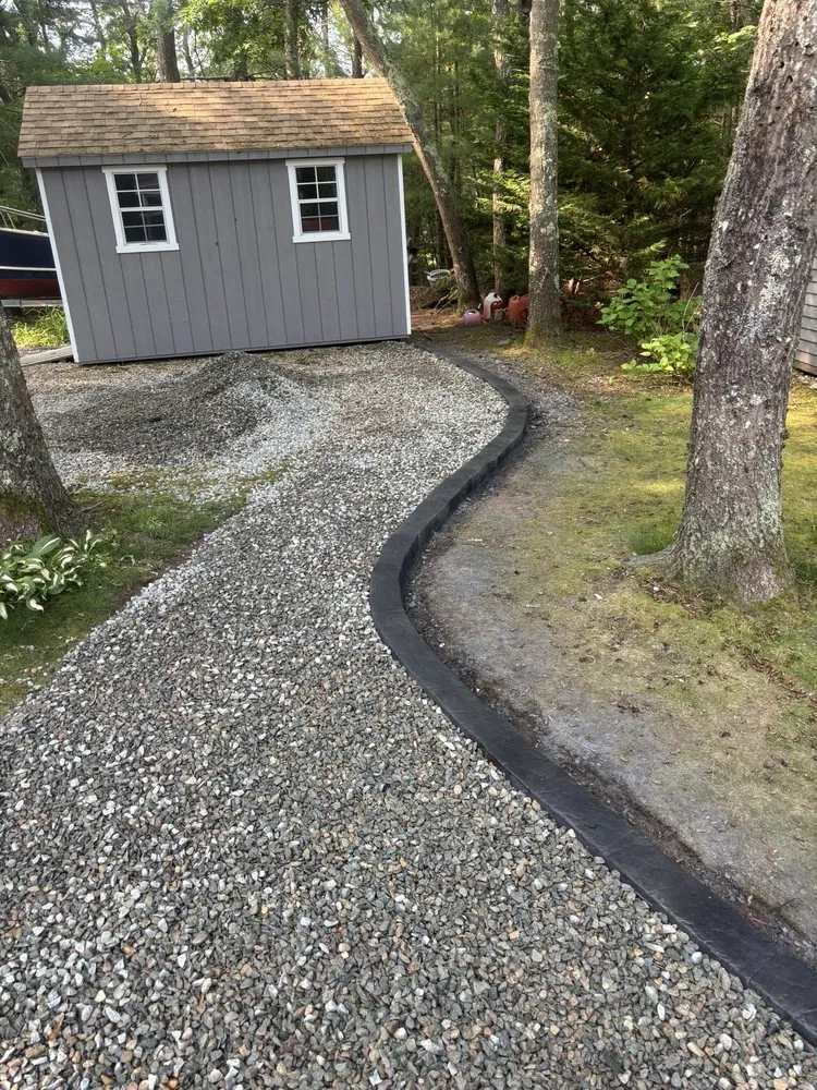 Custom yard cleanup service in East Falmouth, MA by Carpenter Concrete Curbing