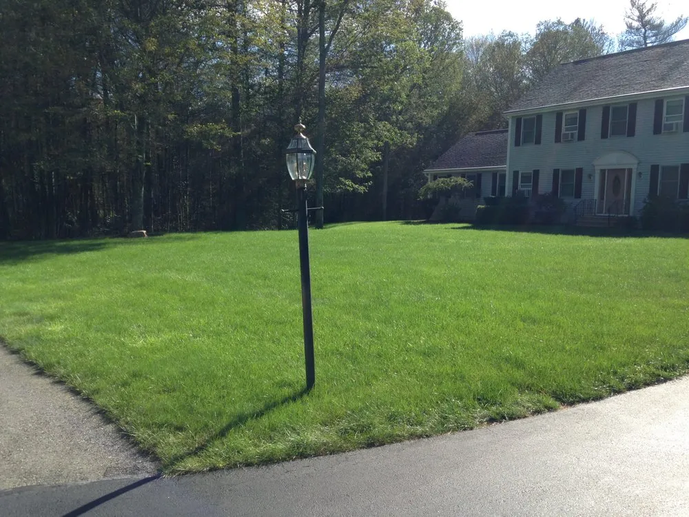 Professional landscaping services for residential properties in Acton, MA by Carrier's Turf Pros Lawn Care