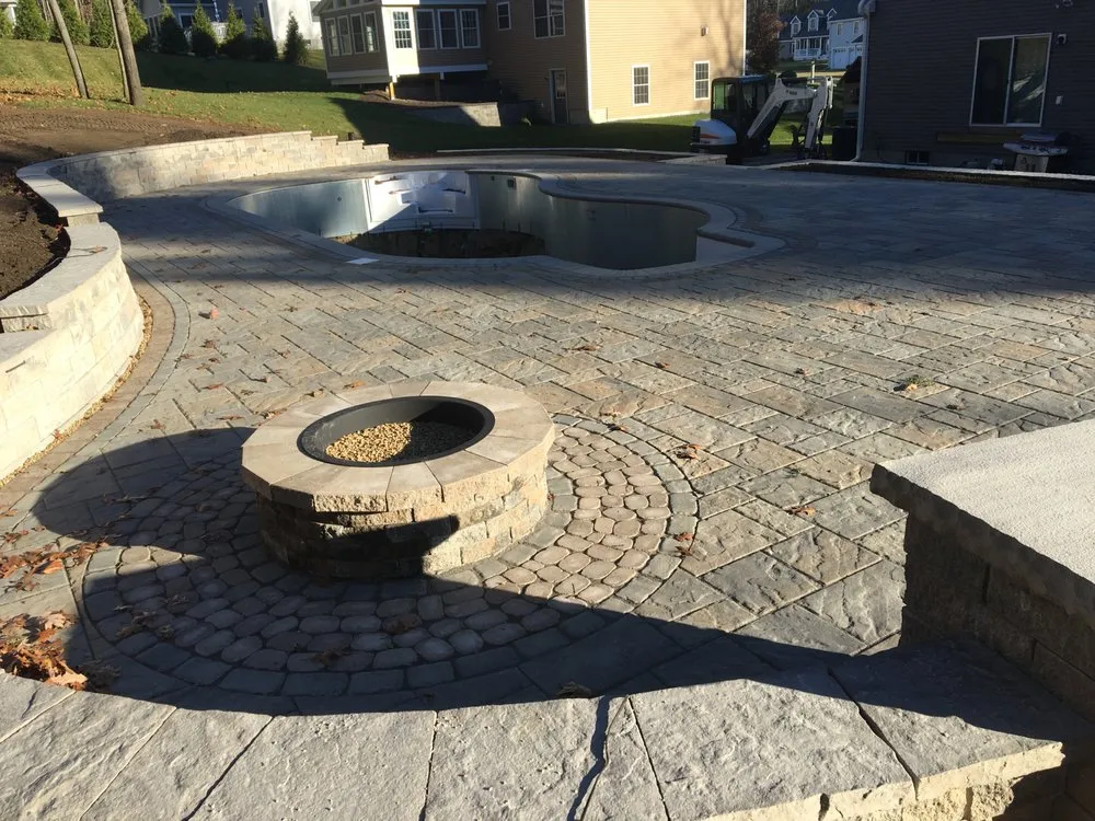 Custom landscape installation for residential properties in Hudson, NH by Carroll Landscape & Irrigation