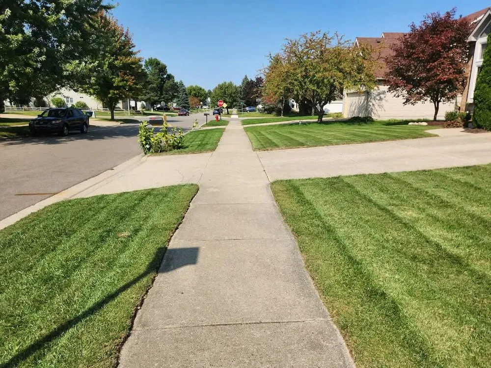 Affordable lawn mowing service for homes in Lansing, MI by Carter and Sons Lawn Care