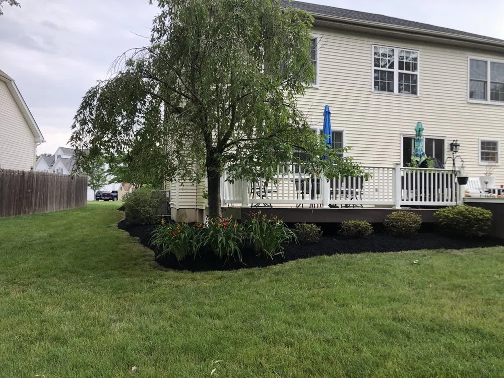 Custom yard cleanup service for year-round maintenance in Doylestown, PA by Castro Landscaping