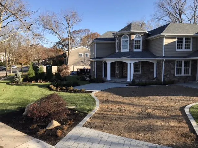 Custom lawn mowing service with custom design across East Northport, NY - Catania Landscape and Design
