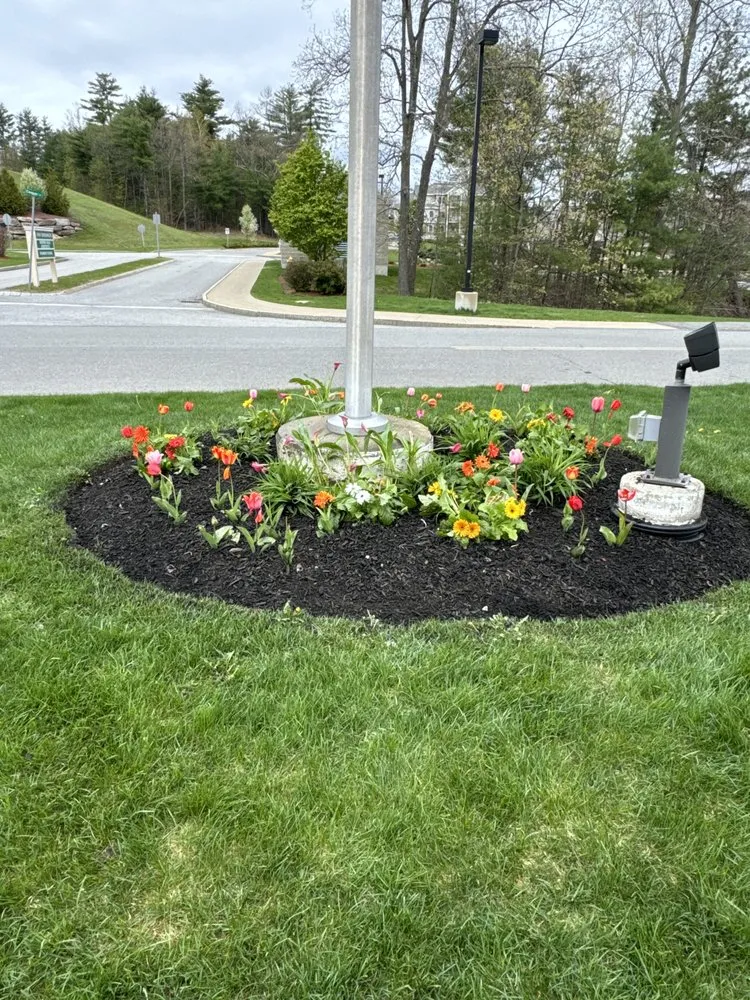 Professional lawn mowing service for year-round maintenance in Auburn, NH by CCMJ Landscaping