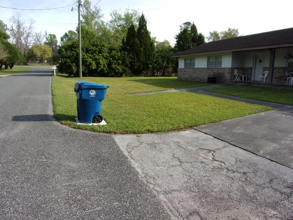Custom yard cleanup service for homes in Brooksville, FL by Chartier Mowing Services