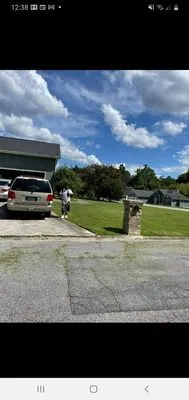 CHI - MAN Lawn Services Logo