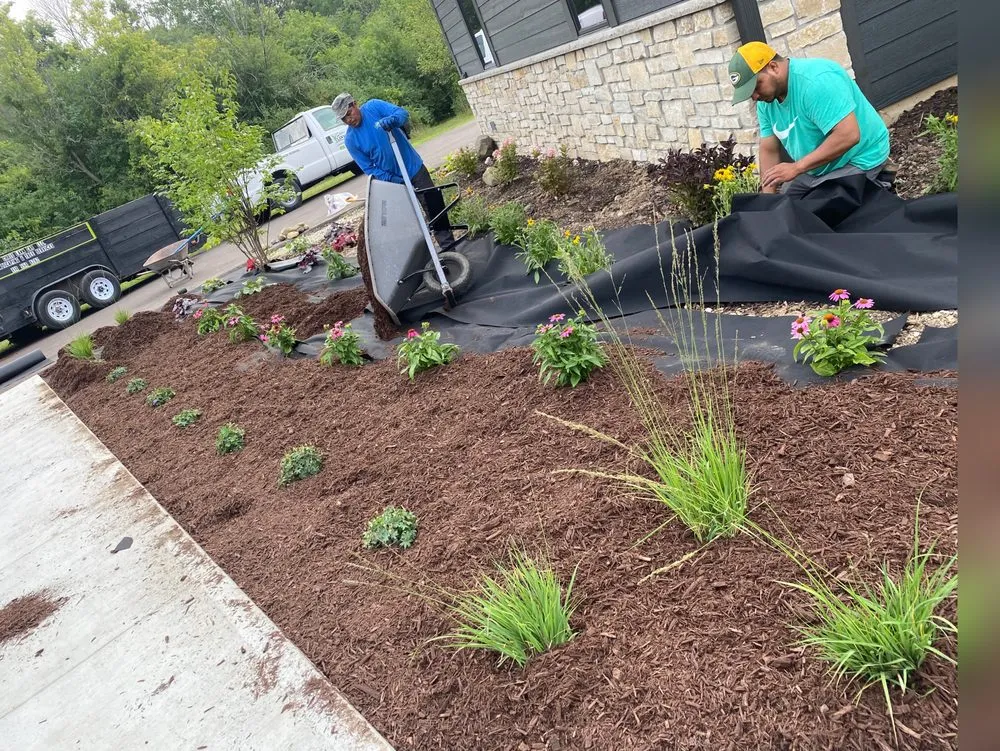 Custom outdoor landscaping for year-round maintenance in Milwaukee, WI by Chris Tree service