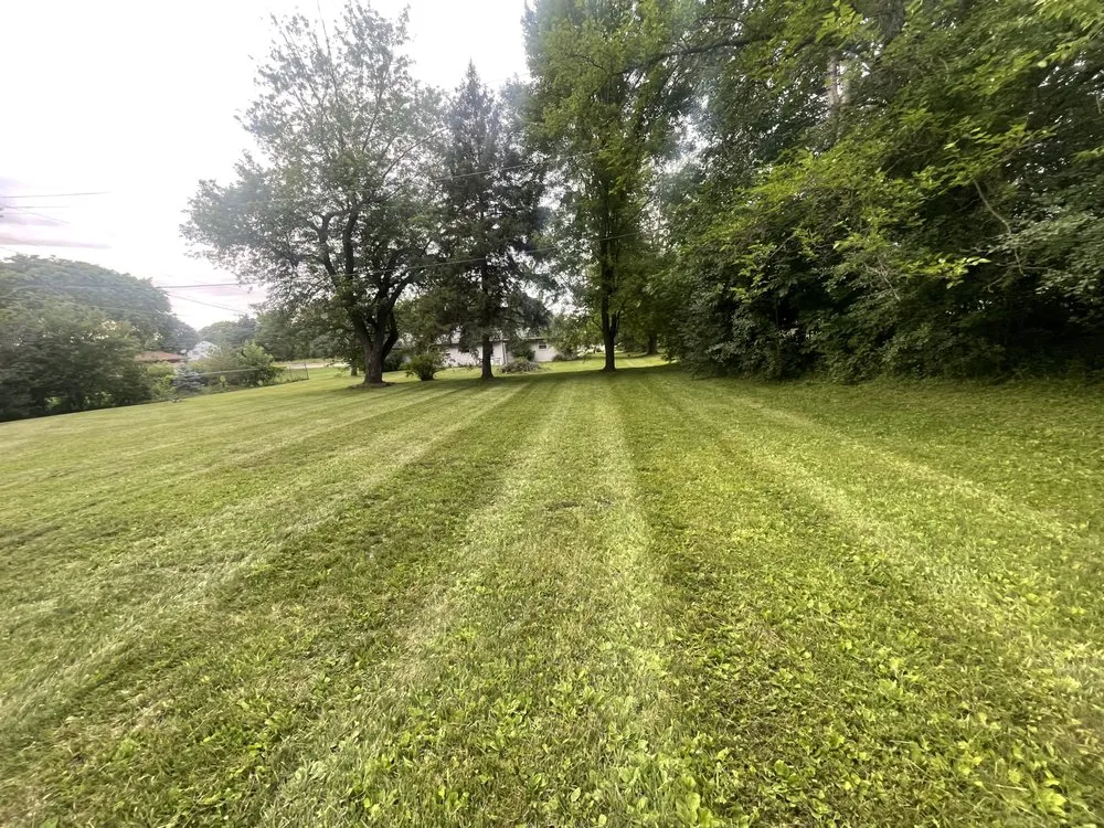 Expert lawn mowing service for residential properties in Flint, MI by Christopher & Brothers Lawn Service