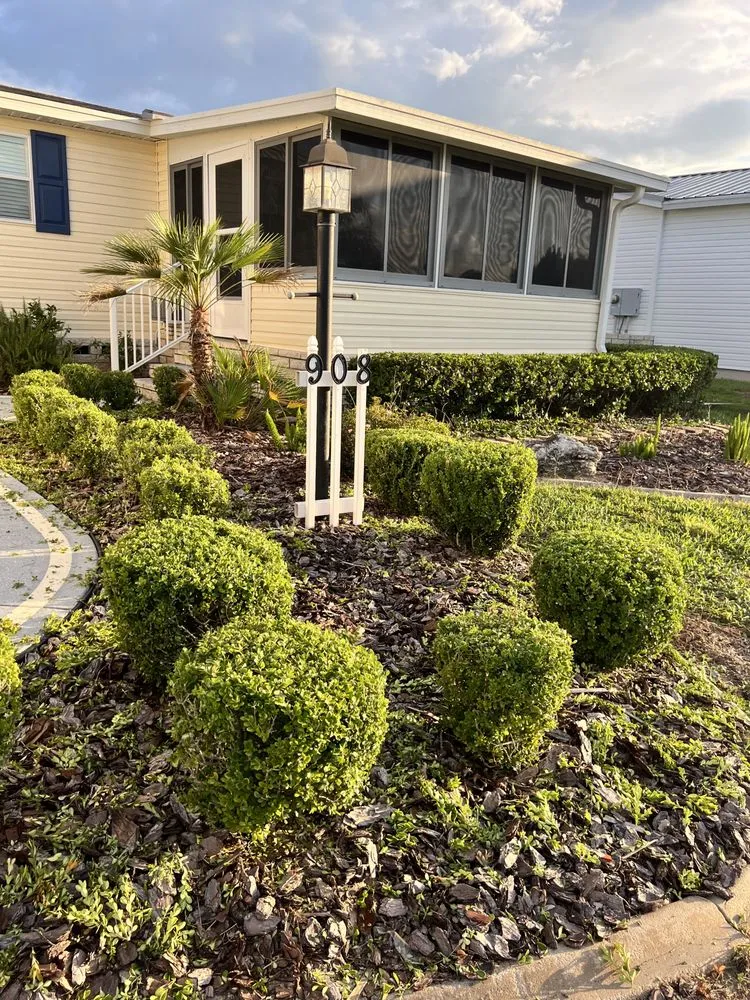 Trusted lawn mowing service with custom design in Summerfield, FL by Clark Landscaping