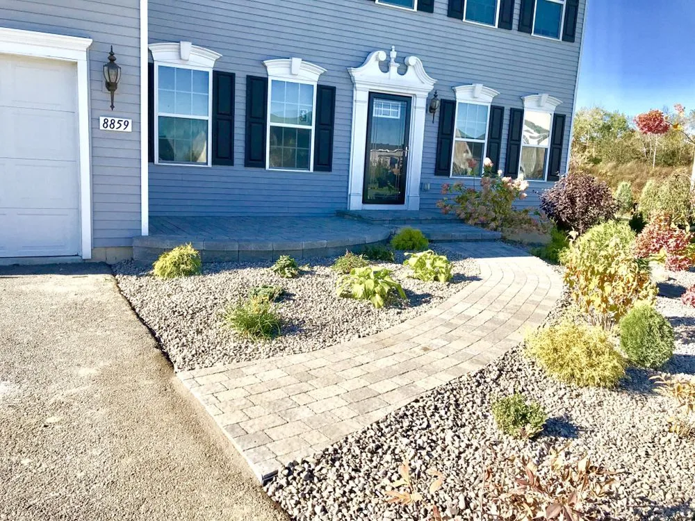 Affordable landscape design with custom design in East Syracuse, NY by Clarkes Landscape Solutions