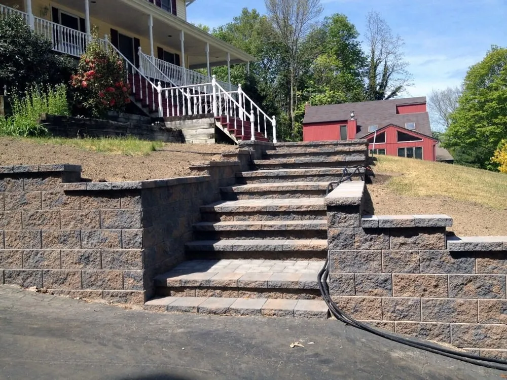 Professional garden landscaping for homes in Farmingville, NY by Classic Paving INC