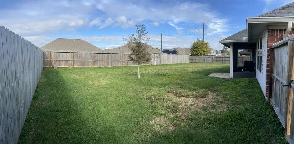 Custom landscape installation in Angleton, TX by Clean Cut