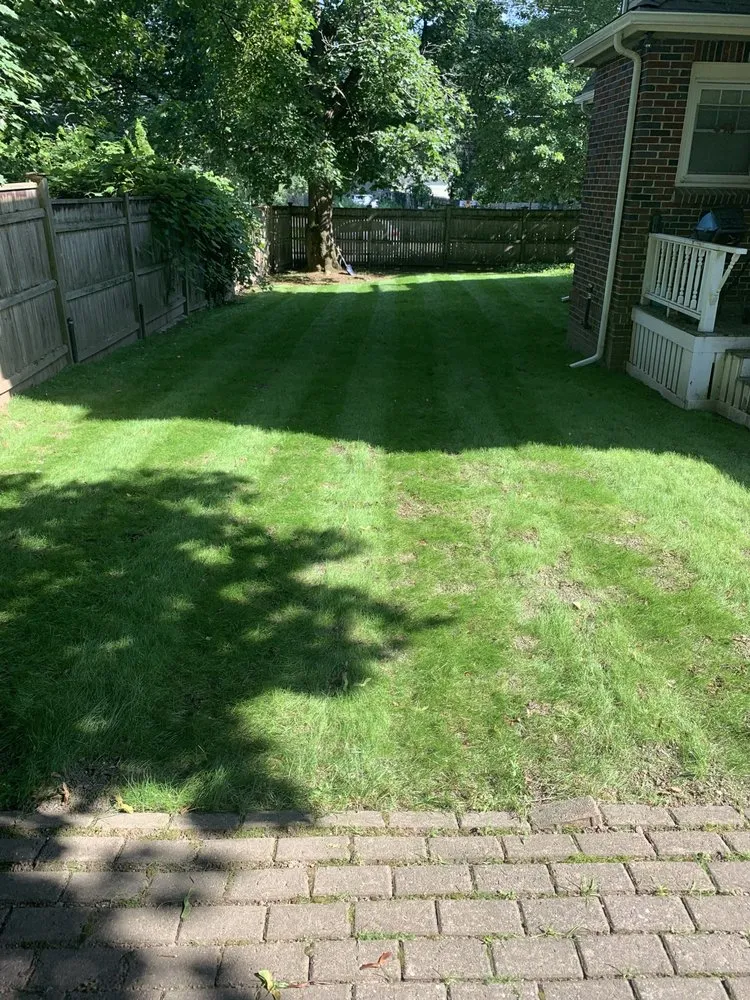 Professional lawn mowing service in Belmont, MA by Clean Cuts Landscaping