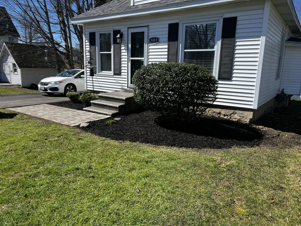Professional lawn care service for residential properties in Oswego, NY by Clean it up Landscaping