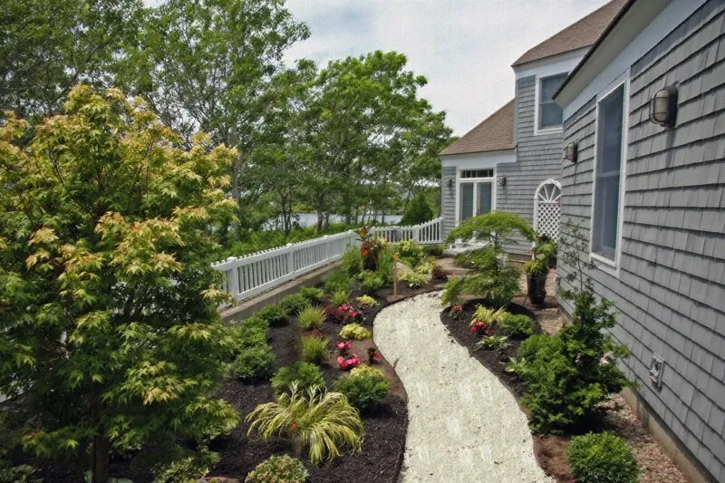 Professional outdoor landscaping with custom design in Falmouth, MA by Clover Landscaping