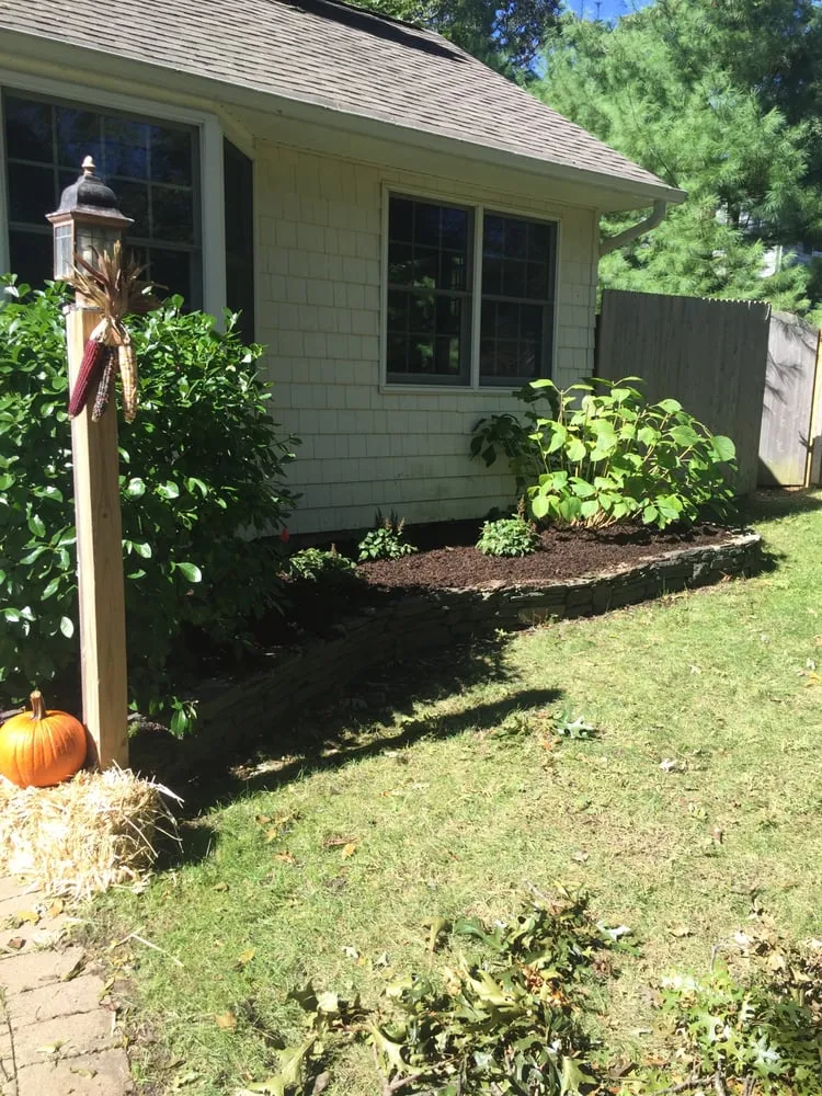 Professional yard maintenance for year-round maintenance in Stony Brook, NY by Clovis Axion