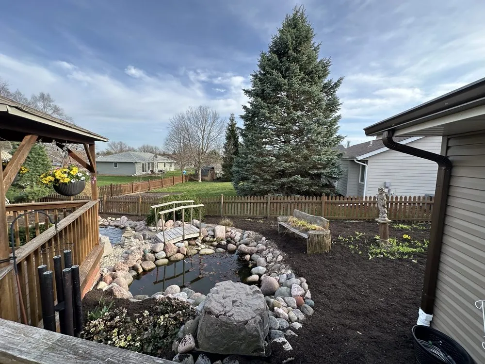 Custom outdoor landscaping with custom design in Rockford, IL by Clutch Cutz Lawn Care