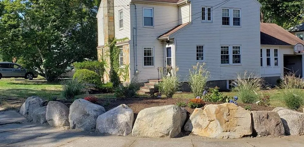 Custom outdoor landscaping for residential properties in Weymouth, MA by CMC Hardscape & Masonry