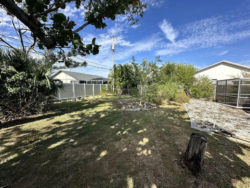 Expert yard cleanup service for residential properties in Lehigh Acres, FL by CNA Lawn Care & Landscaping