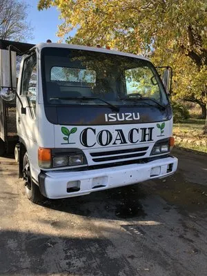 Coach Pest & Lawn Logo
