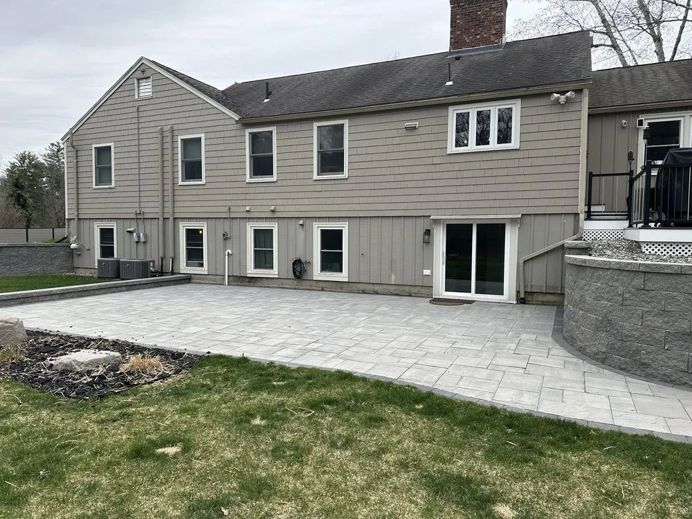 Professional lawn mowing service for residential properties across Seabrook, NH - Coastal Landscaping and Masonry