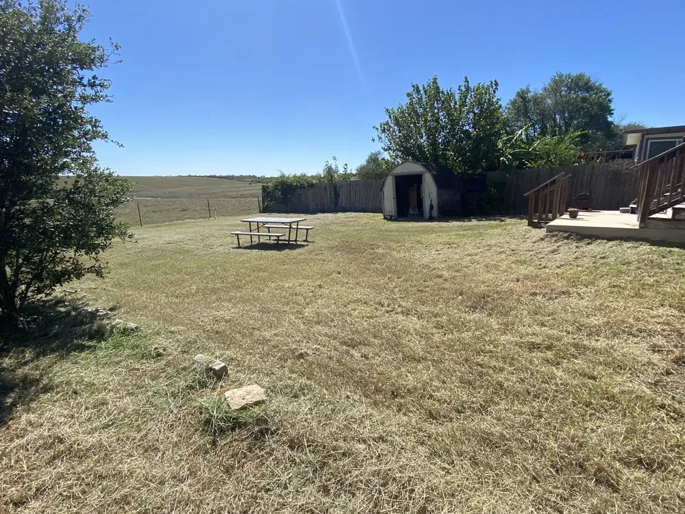 Trusted lawn care service in New Braunfels, TX by Community Fence