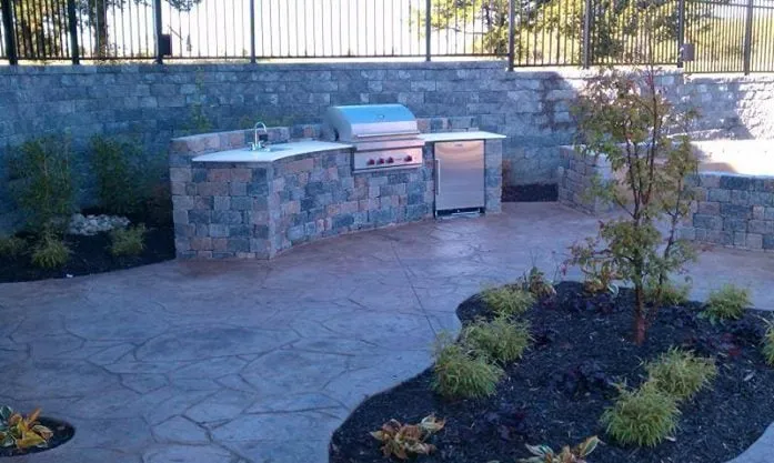 Affordable lawn care service in Olathe, KS by Concrete Concepts