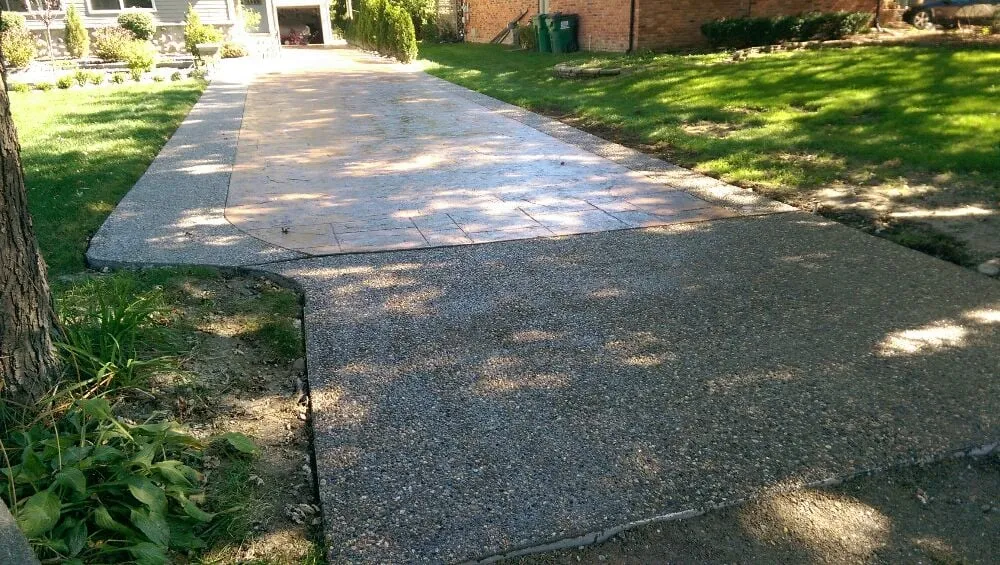 Local lawn mowing service for homes across Harrison Township, MI - Concrete Xcapes