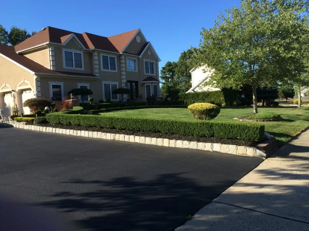 Custom landscape installation for year-round maintenance in Monroe Township, NJ by Conde's Landscaping