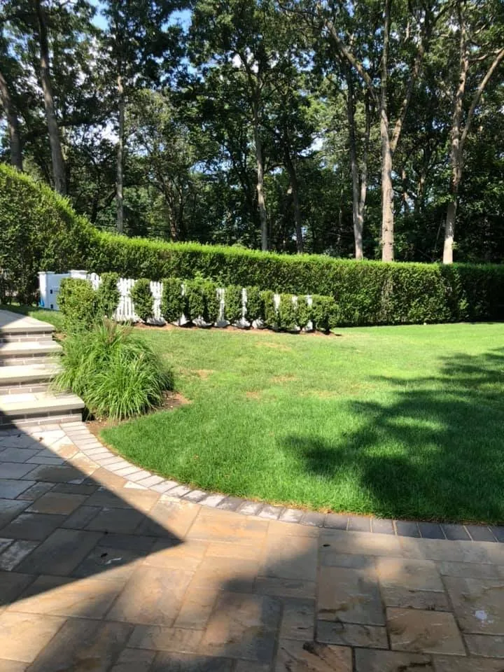 Local lawn care service with custom design in Sayville, NY by Confer Haase Landscaping