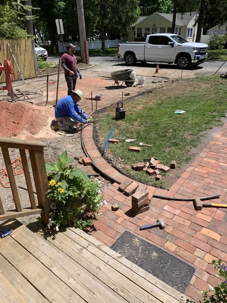 Professional landscaping services for homes in Ronkonkoma, NY by Confer HAASE