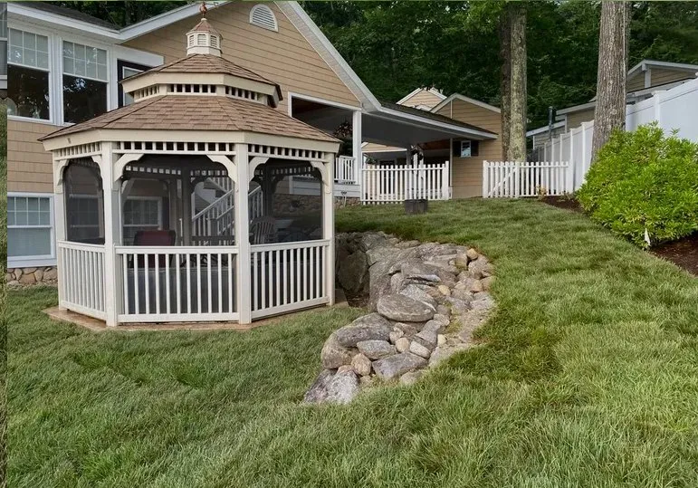 Custom landscape design for year-round maintenance in Moultonborough, NH by Conti Property Solutions
